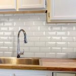 White kitchen apron made of decorative tiles