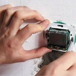 Photo - Installing a thermostat