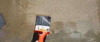 Applying primer to the wall