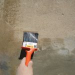 Applying primer to the wall