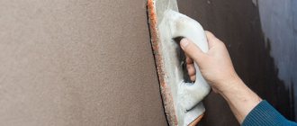 Renovating the façade by grinding plaster