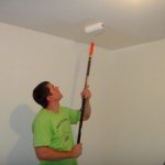 Painting the ceiling with a roller