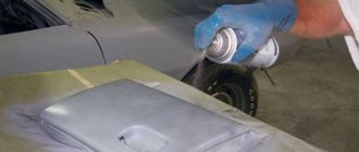 Painting a car part with a spray can