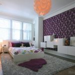 Lilac children&#39;s room, decorated with white and textured items