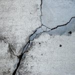 Cracks in concrete on the street