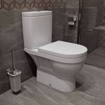 Compact toilet with bottom water supply